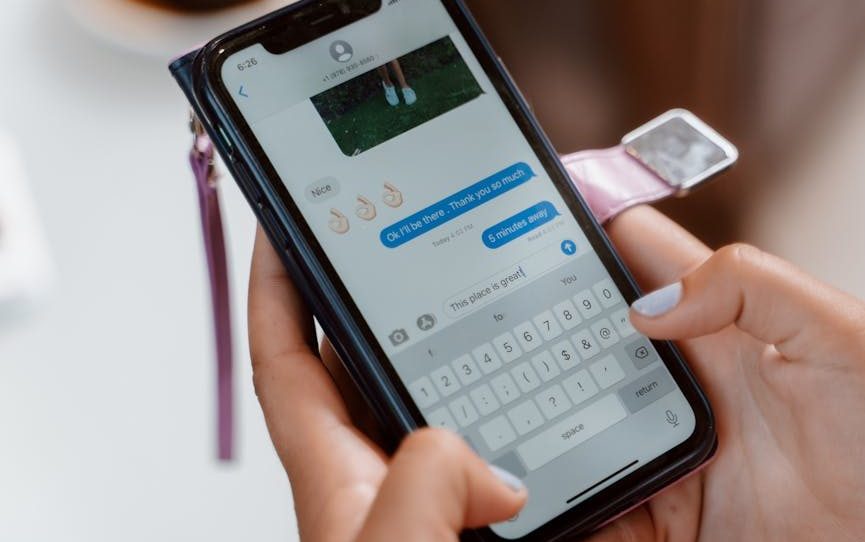Close-Up Shot of a Person Sending Text Message