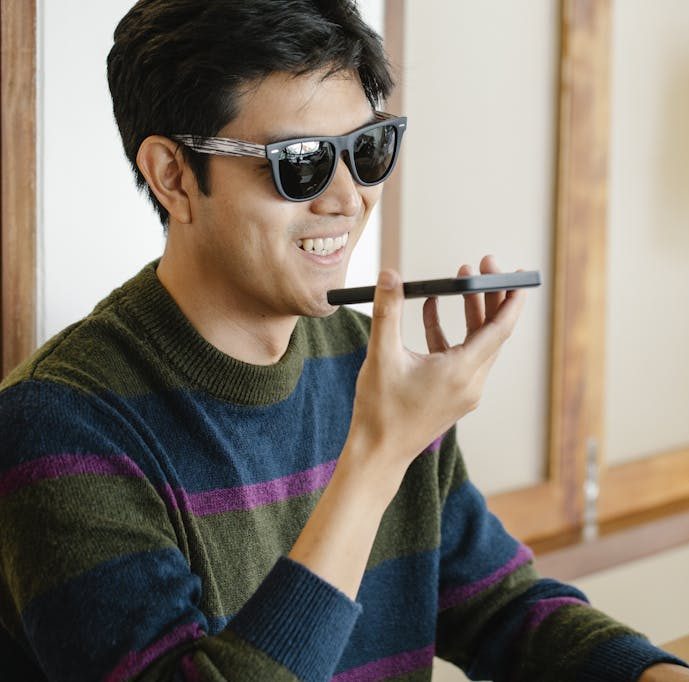 Photo of Man in Casual Oufit Talking to the Phone